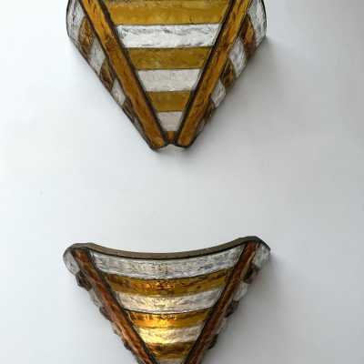Mid-century wall sconces in hammered glass and wrought iron, with a gold and copper patina, in the brutalist style, made by the Italian manufacturer Longobard, a competitor of Biancardi Jordan in Verona and Poliarte in the 1970s. Famous designers, such as Carlo Aldo Nason for Mazzega Murano, Venini, Vistosi, La Murrina, Esperia and Angelo Brotto.