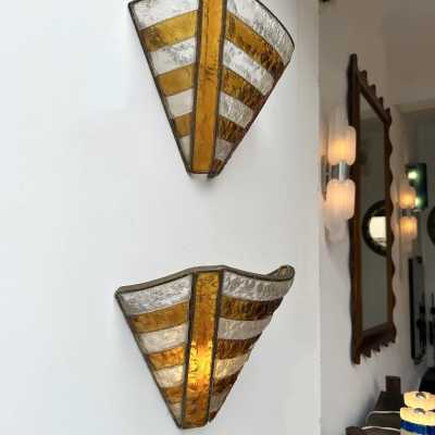 Mid-century wall sconces in hammered glass and wrought iron, with a gold and copper patina, in the brutalist style, made by the Italian manufacturer Longobard, a competitor of Biancardi Jordan in Verona and Poliarte in the 1970s. Famous designers, such as Carlo Aldo Nason for Mazzega Murano, Venini, Vistosi, La Murrina, Esperia and Angelo Brotto.