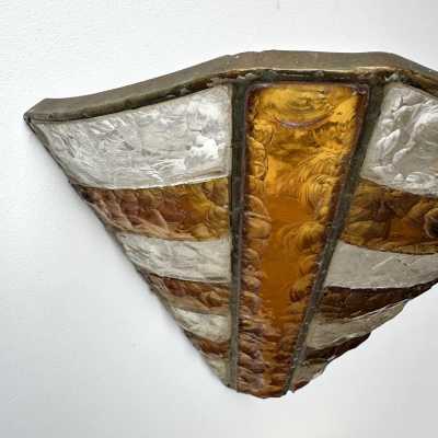 Mid-century wall sconces in hammered glass and wrought iron, with a gold and copper patina, in the brutalist style, made by the Italian manufacturer Longobard, a competitor of Biancardi Jordan in Verona and Poliarte in the 1970s. Famous designers, such as Carlo Aldo Nason for Mazzega Murano, Venini, Vistosi, La Murrina, Esperia and Angelo Brotto.
