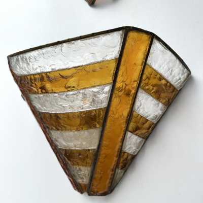 Mid-century wall sconces in hammered glass and wrought iron, with a gold and copper patina, in the brutalist style, made by the Italian manufacturer Longobard, a competitor of Biancardi Jordan in Verona and Poliarte in the 1970s. Famous designers, such as Carlo Aldo Nason for Mazzega Murano, Venini, Vistosi, La Murrina, Esperia and Angelo Brotto.
