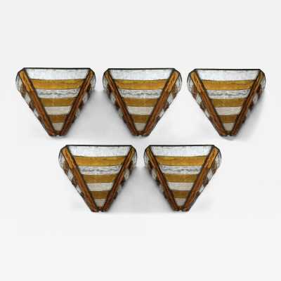 Mid-century wall sconces in hammered glass and wrought iron, with a gold and copper patina, in the brutalist style, made by the Italian manufacturer Longobard, a competitor of Biancardi Jordan in Verona and Poliarte in the 1970s. Famous designers, such as Carlo Aldo Nason for Mazzega Murano, Venini, Vistosi, La Murrina, Esperia and Angelo Brotto.