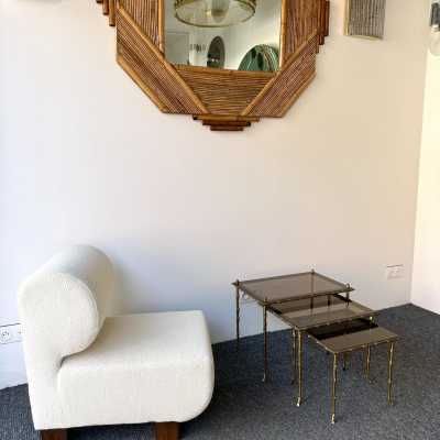 Set of three bamboo nesting or stacking tables, Mid-Century Modern style, in gilded bronze with smoked glass top, by the French manufacturer Maison Baguès. Famous houses such as Maison Jansen, Roger Robert Thibier, Charles, Ramsey and Romeo Rega were also represented.