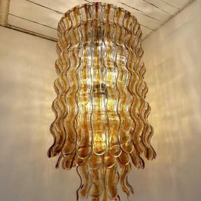 Hollywood Regency cascading wave chandelier mid-century modern space age, clear amber Murano glass pendant and gold metal frame by Mazzega Manufacture, design attributed to Carlo Nason. Famous manufactory such as Venini, Veronese, La Murrina, Aldo Nason, Stilnovo, Joe Colombo, Arteluce, Arredoluce, Lumi, Luci, Rggiani, Sciolari, Werner Pantone, Luigi Colani, Raak, Angelo Lelii, Angelo Brotto, Esperia, Francesco Bocola, Superstudio, Enrico Tronconi, Mario Bellini, Harvey Guzzi