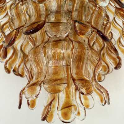 Hollywood Regency cascading wave chandelier mid-century modern space age, clear amber Murano glass pendant and gold metal frame by Mazzega Manufacture, design attributed to Carlo Nason. Famous manufactory such as Venini, Veronese, La Murrina, Aldo Nason, Stilnovo, Joe Colombo, Arteluce, Arredoluce, Lumi, Luci, Rggiani, Sciolari, Werner Pantone, Luigi Colani, Raak, Angelo Lelii, Angelo Brotto, Esperia, Francesco Bocola, Superstudio, Enrico Tronconi, Mario Bellini, Harvey Guzzi