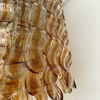 Hollywood Regency cascading wave chandelier mid-century modern space age, clear amber Murano glass pendant and gold metal frame by Mazzega Manufacture, design attributed to Carlo Nason. Famous manufactory such as Venini, Veronese, La Murrina, Aldo Nason, Stilnovo, Joe Colombo, Arteluce, Arredoluce, Lumi, Luci, Rggiani, Sciolari, Werner Pantone, Luigi Colani, Raak, Angelo Lelii, Angelo Brotto, Esperia, Francesco Bocola, Superstudio, Enrico Tronconi, Mario Bellini, Harvey Guzzi
