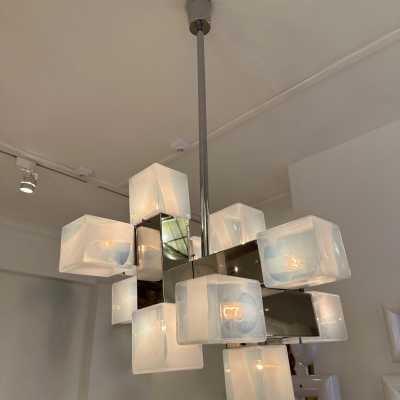 Cube-shaped pendant chandelier in blue opaline Murano glass and chrome-plated metal, manufactured by Mazzega. Designs by major brands such as Venini, Vistosi, La Murrina, Poliarte, Carlo Aldo Nason, and Toni Zuccheri.