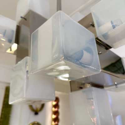 Cube-shaped pendant chandelier in blue opaline Murano glass and chrome-plated metal, manufactured by Mazzega. Designs by major brands such as Venini, Vistosi, La Murrina, Poliarte, Carlo Aldo Nason, and Toni Zuccheri.