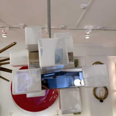 Cube-shaped pendant chandelier in blue opaline Murano glass and chrome-plated metal, manufactured by Mazzega. Designs by major brands such as Venini, Vistosi, La Murrina, Poliarte, Carlo Aldo Nason, and Toni Zuccheri.