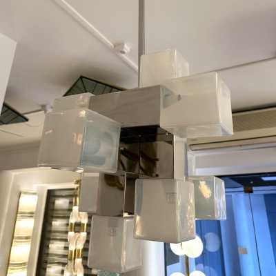 Cube-shaped pendant chandelier in blue opaline Murano glass and chrome-plated metal, manufactured by Mazzega. Designs by major brands such as Venini, Vistosi, La Murrina, Poliarte, Carlo Aldo Nason, and Toni Zuccheri.