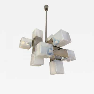 Cube-shaped pendant chandelier in blue opaline Murano glass and chrome-plated metal, manufactured by Mazzega. Designs by major brands such as Venini, Vistosi, La Murrina, Poliarte, Carlo Aldo Nason, and Toni Zuccheri.