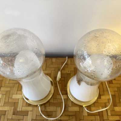 Pair or set of 2 Mid-Century Modern Space Age table or bedside lamps from the Mazzega factory. Design attributed to Carlo Nason, brass and blown Murano glass. Famous manufactory such as Venini, Vistosi, La Murrina, Seguso, Carlo Aldo Nason, Poliarte, Esperia, Angelo Brotto, Stilnovo, Arteluce, Arredoluce, Artemide, Pierre Cardin, Lumi, Luci, Raak, Angelo Lelii, Francesco Bocola, Superstudio, Enrico Tronconi, Mario Bellini, Harvey Guzzini, Luigi Massoni, Martinelli, Fabio Lenci, Gio Ponti.