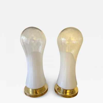 Pair or set of 2 Mid-Century Modern Space Age table or bedside lamps from the Mazzega factory. Design attributed to Carlo Nason, brass and blown Murano glass. Famous manufactory such as Venini, Vistosi, La Murrina, Seguso, Carlo Aldo Nason, Poliarte, Esperia, Angelo Brotto, Stilnovo, Arteluce, Arredoluce, Artemide, Pierre Cardin, Lumi, Luci, Raak, Angelo Lelii, Francesco Bocola, Superstudio, Enrico Tronconi, Mario Bellini, Harvey Guzzini, Luigi Massoni, Martinelli, Fabio Lenci, Gio Ponti.
