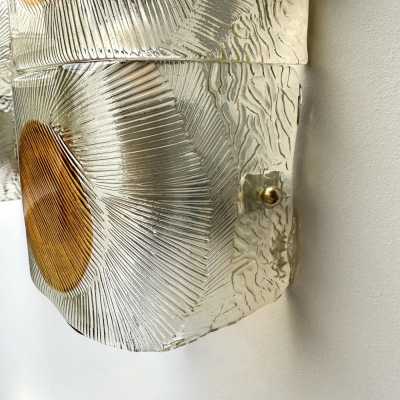 Pair of mid-century modern space age wall sconces in orange and clear textured Murano glass by the Mazzega factory. Famous Italian design like Venini, Vistosi, La Murrina, Aldo Carlo Nason, Toni Zuccheri, Stilnovo, Joe Colombo, Arteluce, Arredoluce, Lumi, Luci, Rggiani, Sciolari, Werner Pantone, Luigi Colani, Raak, Angelo Lelii, Angelo Brotto, Esperia, Francesco Bocola, Superstudio, Enrico Tronconi, Mario Bellini, Harvey Guzzini, Luigi Massoni, Martinelli, Pierre Cardin, Fabio Lenci, Gi