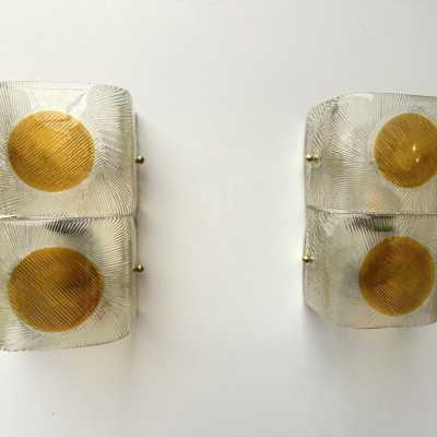 Pair of mid-century modern space age wall sconces in orange and clear textured Murano glass by the Mazzega factory. Famous Italian design like Venini, Vistosi, La Murrina, Aldo Carlo Nason, Toni Zuccheri, Stilnovo, Joe Colombo, Arteluce, Arredoluce, Lumi, Luci, Rggiani, Sciolari, Werner Pantone, Luigi Colani, Raak, Angelo Lelii, Angelo Brotto, Esperia, Francesco Bocola, Superstudio, Enrico Tronconi, Mario Bellini, Harvey Guzzini, Luigi Massoni, Martinelli, Pierre Cardin, Fabio Lenci, Gi