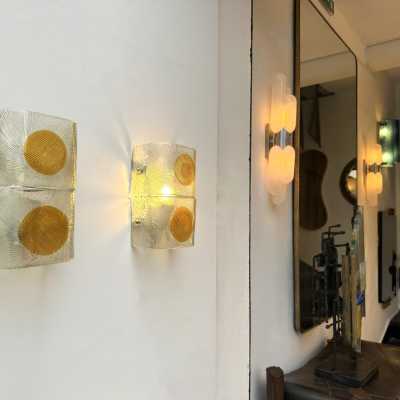 Pair of mid-century modern space age wall sconces in orange and clear textured Murano glass by the Mazzega factory. Famous Italian design like Venini, Vistosi, La Murrina, Aldo Carlo Nason, Toni Zuccheri, Stilnovo, Joe Colombo, Arteluce, Arredoluce, Lumi, Luci, Rggiani, Sciolari, Werner Pantone, Luigi Colani, Raak, Angelo Lelii, Angelo Brotto, Esperia, Francesco Bocola, Superstudio, Enrico Tronconi, Mario Bellini, Harvey Guzzini, Luigi Massoni, Martinelli, Pierre Cardin, Fabio Lenci, Gi
