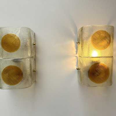 Pair of mid-century modern space age wall sconces in orange and clear textured Murano glass by the Mazzega factory. Famous Italian design like Venini, Vistosi, La Murrina, Aldo Carlo Nason, Toni Zuccheri, Stilnovo, Joe Colombo, Arteluce, Arredoluce, Lumi, Luci, Rggiani, Sciolari, Werner Pantone, Luigi Colani, Raak, Angelo Lelii, Angelo Brotto, Esperia, Francesco Bocola, Superstudio, Enrico Tronconi, Mario Bellini, Harvey Guzzini, Luigi Massoni, Martinelli, Pierre Cardin, Fabio Lenci, Gi