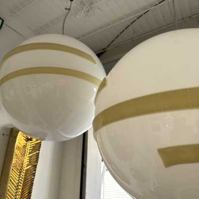 Saturn ufo ball pendant light, Space Age style, in opaline white Murano glass and cream beige stripes, Mid-Century Modern style, by the Italian manufacturer Murano Due. Renowned manufacturers like Venini, Veronese, La Murrina, Aldo Nason, Stilnovo, Joe Colombo, Arteluce, Arredoluce, Lumi, Luci, Mazzega, Sciolari, Werner Pantone, Luigi Colani, Raak, Angelo Lelii, Angelo Brotto, Esperia, Francesco Bocola, Superstudio, Enrico Tronconi, Mario Bellini, Harvey Guzzini, Luigi Massoni, Martinelli, Pierre C