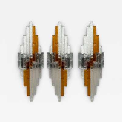 Mid-century Space Age wall lights in hammered glass and metal, in the Brutalist style, manufactured by the Poliarte factory in Verona, a competitor of Longobard Arte and Biancardi Jordan in the 1970s. Famous designers, such as Carlo Aldo Nason for Mazzega Murano, Venini, Vistosi, La Murrina, Esperia and Angelo Brotto.