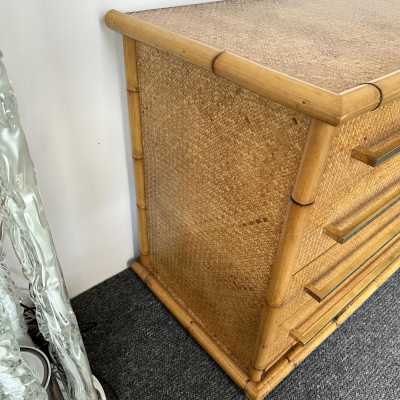 Chest of drawers from Vivai Del Sud, featuring a beautiful blend of bamboo, rattan, raffia, and wide brass handles. Designed by renowned designers such as Renato Zevi, Romeo Rega, Maison Jansen, Willy Rizzo, Mario Sabot, Hollywood Regency, Esperia, and Galerie Maison & Jardin.
