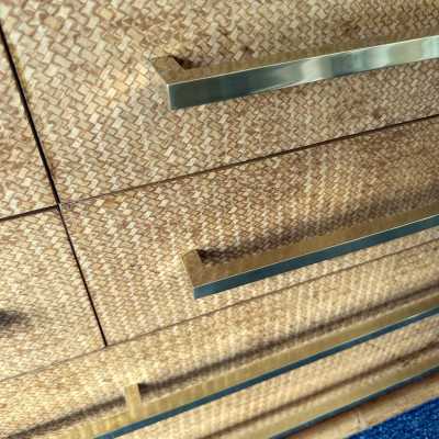 Chest of drawers from Vivai Del Sud, featuring a beautiful blend of bamboo, rattan, raffia, and wide brass handles. Designed by renowned designers such as Renato Zevi, Romeo Rega, Maison Jansen, Willy Rizzo, Mario Sabot, Hollywood Regency, Esperia, and Galerie Maison & Jardin.