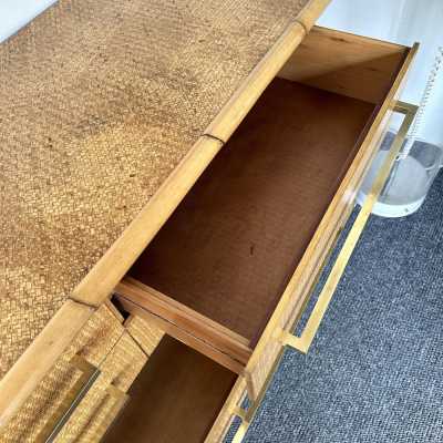 Chest of drawers from Vivai Del Sud, featuring a beautiful blend of bamboo, rattan, raffia, and wide brass handles. Designed by renowned designers such as Renato Zevi, Romeo Rega, Maison Jansen, Willy Rizzo, Mario Sabot, Hollywood Regency, Esperia, and Galerie Maison & Jardin.