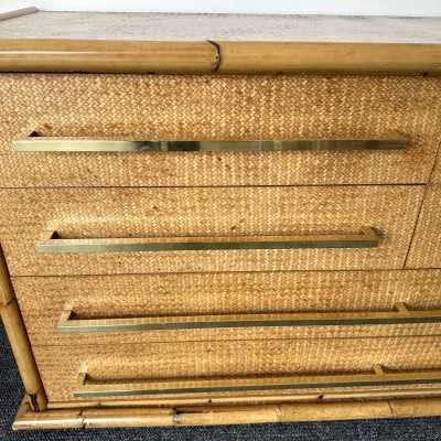 Chest of drawers from Vivai Del Sud, featuring a beautiful blend of bamboo, rattan, raffia, and wide brass handles. Designed by renowned designers such as Renato Zevi, Romeo Rega, Maison Jansen, Willy Rizzo, Mario Sabot, Hollywood Regency, Esperia, and Galerie Maison & Jardin.