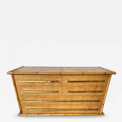 Chest of drawers from Vivai Del Sud, featuring a beautiful blend of bamboo, rattan, raffia, and wide brass handles. Designed by renowned designers such as Renato Zevi, Romeo Rega, Maison Jansen, Willy Rizzo, Mario Sabot, Hollywood Regency, Esperia, and Galerie Maison & Jardin.
