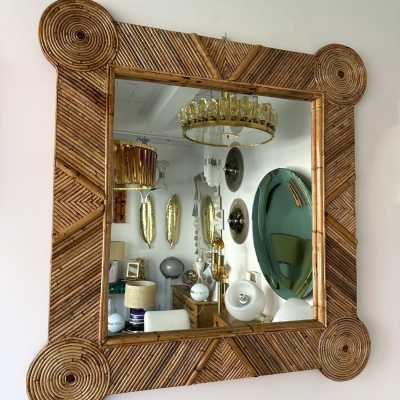 Large mid-century Hollywood Regency wall mirror made of bamboo, rattan, raffia, and wicker by the Italian manufacturer Vivai del Sud. Original manufacturer stamp on the back. Famous designs by Maison Arpex International, Dal Vera, Renato Zevi, Romeo Rega, Maison Jansen, brass palm, and Mario Sabot.