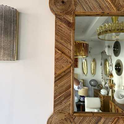 Large mid-century Hollywood Regency wall mirror made of bamboo, rattan, raffia, and wicker by the Italian manufacturer Vivai del Sud. Original manufacturer stamp on the back. Famous designs by Maison Arpex International, Dal Vera, Renato Zevi, Romeo Rega, Maison Jansen, brass palm, and Mario Sabot.