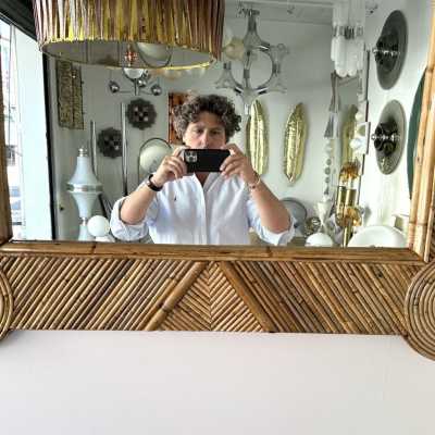 Large mid-century Hollywood Regency wall mirror made of bamboo, rattan, raffia, and wicker by the Italian manufacturer Vivai del Sud. Original manufacturer stamp on the back. Famous designs by Maison Arpex International, Dal Vera, Renato Zevi, Romeo Rega, Maison Jansen, brass palm, and Mario Sabot.