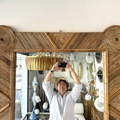 Large mid-century Hollywood Regency wall mirror made of bamboo, rattan, raffia, and wicker by the Italian manufacturer Vivai del Sud. Original manufacturer stamp on the back. Famous designs by Maison Arpex International, Dal Vera, Renato Zevi, Romeo Rega, Maison Jansen, brass palm, and Mario Sabot.