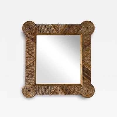 Large mid-century Hollywood Regency wall mirror made of bamboo, rattan, raffia, and wicker by the Italian manufacturer Vivai del Sud. Original manufacturer stamp on the back. Famous designs by Maison Arpex International, Dal Vera, Renato Zevi, Romeo Rega, Maison Jansen, brass palm, and Mario Sabot.