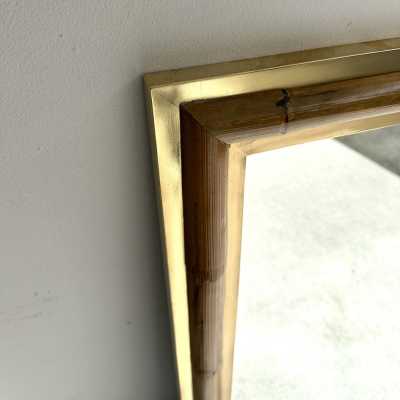 Wall mirror made of brass and bamboo, rattan, raffia, and wicker, from the Italian manufacturer Vivai del Sud. Original manufacturer's stamp on the back. Famous designs by Maison Arpex International, Dal Vera, Renato Zevi, Romeo Rega, Maison Jansen, brass palm tree, and Mario Sabot.