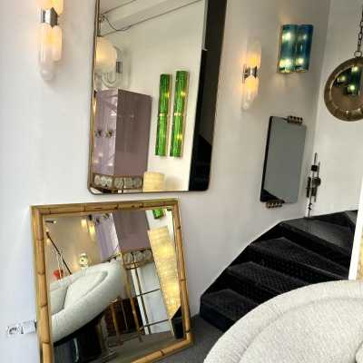 Wall mirror made of brass and bamboo, rattan, raffia, and wicker, from the Italian manufacturer Vivai del Sud. Original manufacturer's stamp on the back. Famous designs by Maison Arpex International, Dal Vera, Renato Zevi, Romeo Rega, Maison Jansen, brass palm tree, and Mario Sabot.