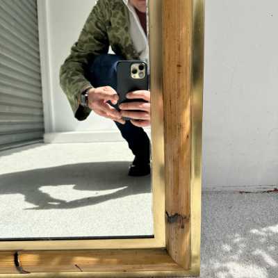 Wall mirror made of brass and bamboo, rattan, raffia, and wicker, from the Italian manufacturer Vivai del Sud. Original manufacturer's stamp on the back. Famous designs by Maison Arpex International, Dal Vera, Renato Zevi, Romeo Rega, Maison Jansen, brass palm tree, and Mario Sabot.