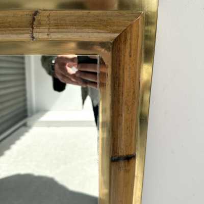 Wall mirror made of brass and bamboo, rattan, raffia, and wicker, from the Italian manufacturer Vivai del Sud. Original manufacturer's stamp on the back. Famous designs by Maison Arpex International, Dal Vera, Renato Zevi, Romeo Rega, Maison Jansen, brass palm tree, and Mario Sabot.