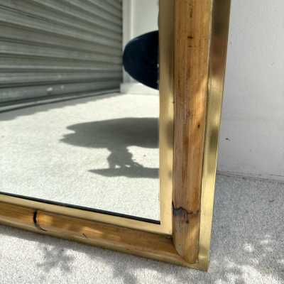 Wall mirror made of brass and bamboo, rattan, raffia, and wicker, from the Italian manufacturer Vivai del Sud. Original manufacturer's stamp on the back. Famous designs by Maison Arpex International, Dal Vera, Renato Zevi, Romeo Rega, Maison Jansen, brass palm tree, and Mario Sabot.