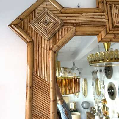Large mid-century Hollywood Regency wall mirror made of bamboo, rattan, raffia, and wicker by the Italian manufacturer Vivai del Sud. Original manufacturer stamp on the back. Famous designs by Maison Arpex International, Dal Vera, Renato Zevi, Romeo Rega, Maison Jansen, brass palm, and Mario Sabot.