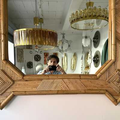 Large mid-century Hollywood Regency wall mirror made of bamboo, rattan, raffia, and wicker by the Italian manufacturer Vivai del Sud. Original manufacturer stamp on the back. Famous designs by Maison Arpex International, Dal Vera, Renato Zevi, Romeo Rega, Maison Jansen, brass palm, and Mario Sabot.