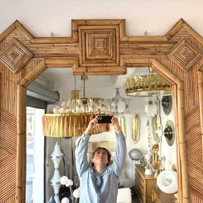 Large mid-century Hollywood Regency wall mirror made of bamboo, rattan, raffia, and wicker by the Italian manufacturer Vivai del Sud. Original manufacturer stamp on the back. Famous designs by Maison Arpex International, Dal Vera, Renato Zevi, Romeo Rega, Maison Jansen, brass palm, and Mario Sabot.