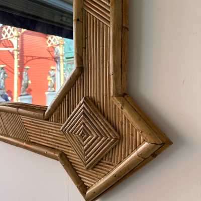 Large mid-century Hollywood Regency wall mirror made of bamboo, rattan, raffia, and wicker by the Italian manufacturer Vivai del Sud. Original manufacturer stamp on the back. Famous designs by Maison Arpex International, Dal Vera, Renato Zevi, Romeo Rega, Maison Jansen, brass palm, and Mario Sabot.