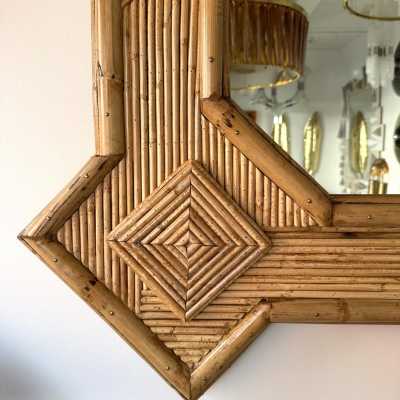Large mid-century Hollywood Regency wall mirror made of bamboo, rattan, raffia, and wicker by the Italian manufacturer Vivai del Sud. Original manufacturer stamp on the back. Famous designs by Maison Arpex International, Dal Vera, Renato Zevi, Romeo Rega, Maison Jansen, brass palm, and Mario Sabot.