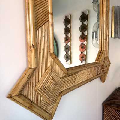 Large mid-century Hollywood Regency wall mirror made of bamboo, rattan, raffia, and wicker by the Italian manufacturer Vivai del Sud. Original manufacturer stamp on the back. Famous designs by Maison Arpex International, Dal Vera, Renato Zevi, Romeo Rega, Maison Jansen, brass palm, and Mario Sabot.
