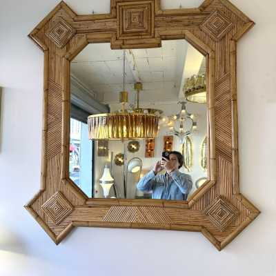 Large mid-century Hollywood Regency wall mirror made of bamboo, rattan, raffia, and wicker by the Italian manufacturer Vivai del Sud. Original manufacturer stamp on the back. Famous designs by Maison Arpex International, Dal Vera, Renato Zevi, Romeo Rega, Maison Jansen, brass palm, and Mario Sabot.