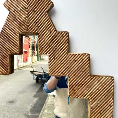 Rare pyramidal wall mirror made of bamboo, rattan, raffia, and wicker, from the Italian manufacturer Vivai del Sud. Original manufacturer's stamp on the back. Famous designers such as Maison Arpex International, Dal Vera, Renato Zevi, Romeo Rega, Palm Tree, Maison Jansen, Willy Rizzo, and Mario Sabot.