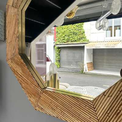 Mid-century modern octagonal wall mirror made of brass and bamboo, rattan, raffia, and wicker by the Italian manufacturer Vivai del Sud. Original manufacturer stamp on the back. Famous designs by Maison Arpex International, Dal Vera, Renato Zevi, Romeo Rega, Maison Jansen, Brass Palm, and Mario Sabot.