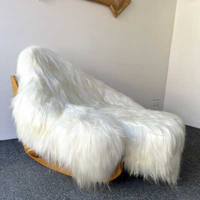 Rare, iconic mid-century modern space age design armchair, the Yeti Rocking Chair in wood and white goat hair fur by designer Mario Scheichenbauer for the Italian manufacturer Elam. New upholstery.
