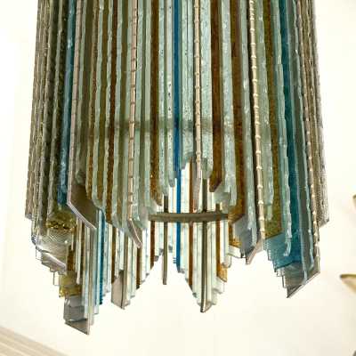 Mid-century modern chandeliers and pendants in hammered glass and silver-plated wrought iron from the Biancardi Jordan factory in Verona, in the Brutalist style, a competitor of Longobard Arte and Poliarte in the 1970s. Famous designers, such as Carlo Aldo Nason for Mazzega Murano, Venini, Vistosi, La Murrina, Esperia and Angelo Brotto.