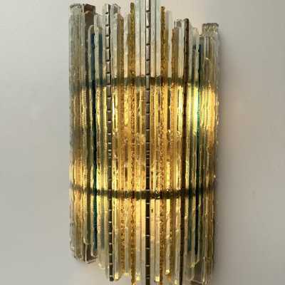 Mid-century modern wall sconces in hammered glass and wrought iron, with a golden patina, from the Biancardi Jordan factory in Verona, in the brutalist style, a competitor of Longobard Arte and Poliarte in the 1970s. Famous designers include Carlo Aldo Nason for Mazzega Murano, Venini, Vistosi, La Murrina, Esperia and Angelo Brotto.