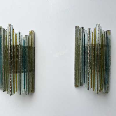 Mid-century modern wall sconces in hammered glass and wrought iron, with a golden patina, from the Biancardi Jordan factory in Verona, in the brutalist style, a competitor of Longobard Arte and Poliarte in the 1970s. Famous designers include Carlo Aldo Nason for Mazzega Murano, Venini, Vistosi, La Murrina, Esperia and Angelo Brotto.